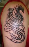 tribal phoenix right arm tattoo